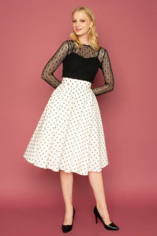 Ψηλόμεση κλος φούστα, μέχρι το γόνατο, με γκρι πουά print και τσέπες για να δημιουργήσετε ένα ρετρό look για όλες τις ώρες!